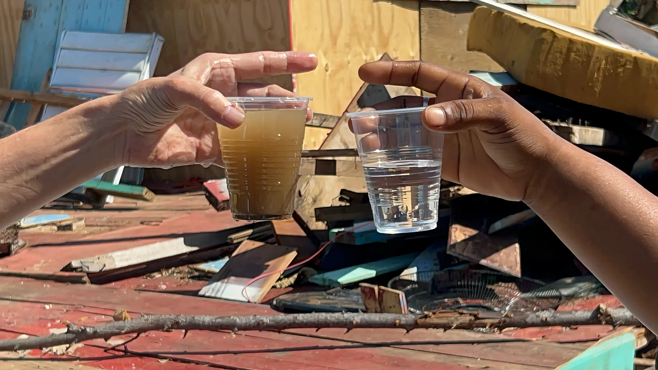 Dirty water and clean filtered water showing the impact of water filtration in Jamaica